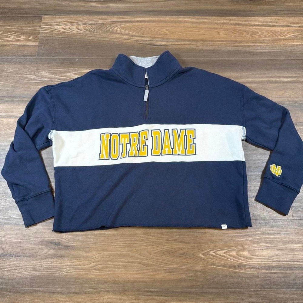 Notre Dame quarter zip sweatshirt with white horizontal stripe and yellow